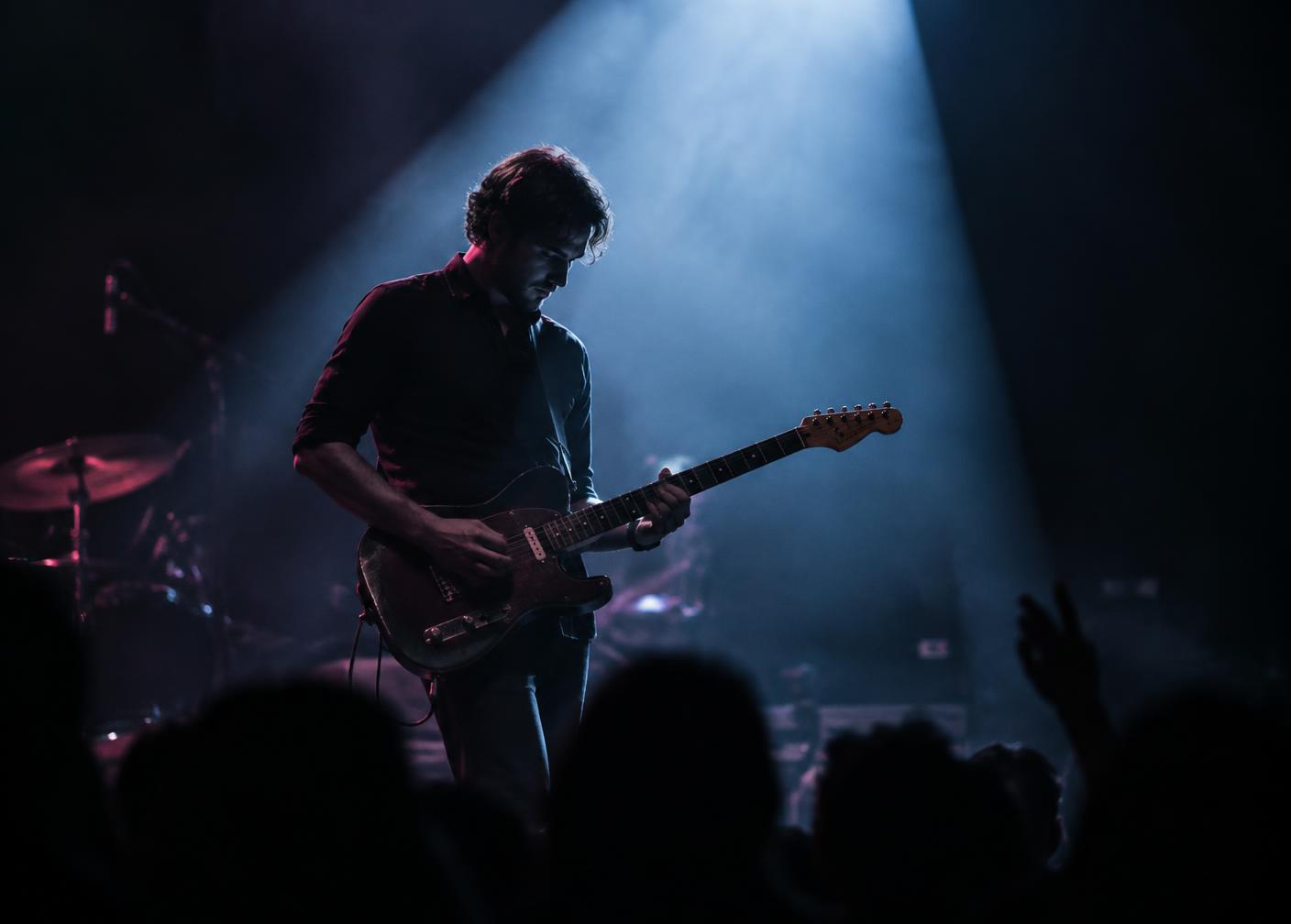 Guitarist under a spotlight